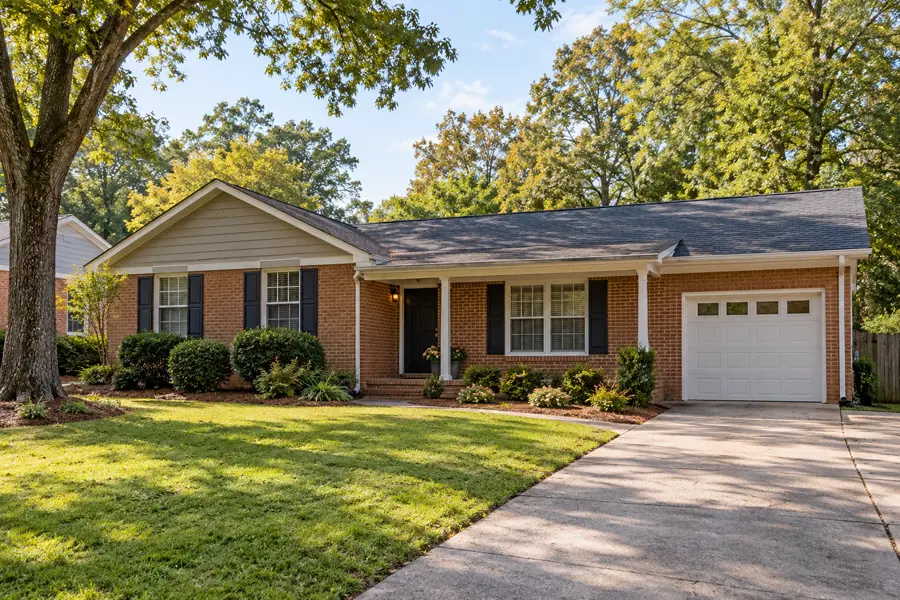 Illustrative exterior of brick ranch with a shaded yard in Atlanta, Georgia
